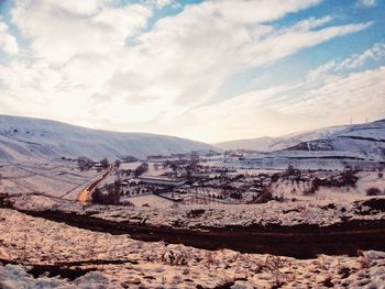 Scenic view of snowcapped mountains against sky