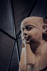 Low angle view of statue against building