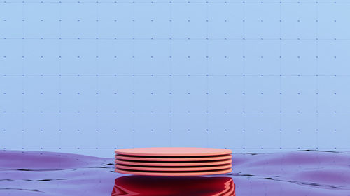 Close-up of coffee cup on table against wall