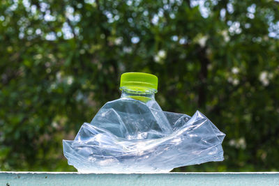 Close-up of water bottle in glass