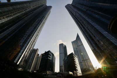 Low angle view of buildings in city against sky