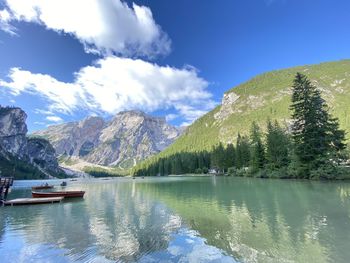 Scenic view of lake and mountains against sky