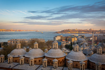 High angle view of topkapi palace and buildings against sky during sunset