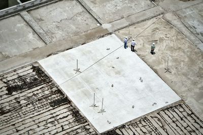Aerial view of construction workers standing at construction site