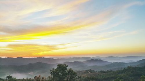 Scenic view of mountains against sky during sunset