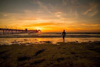 People on beach at sunset