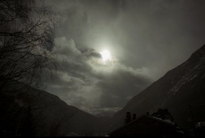 Scenic view of mountains against cloudy sky