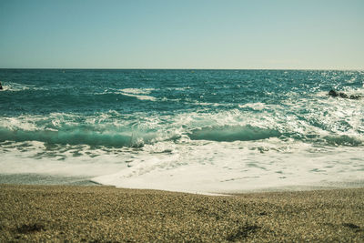 Scenic view of sea against clear sky