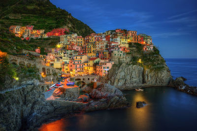 Panoramic view of sea and buildings against sky