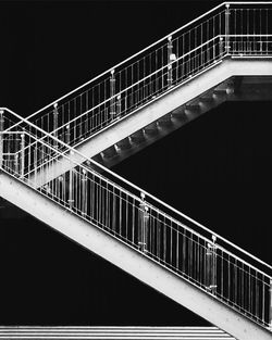 Low angle view of suspension bridge at night