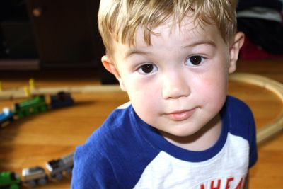 Close-up portrait of cute boy at home