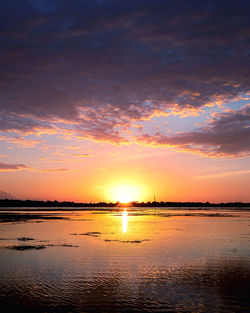 Scenic view of sea against romantic sky at sunset