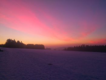 Scenic view of landscape against sky during winter