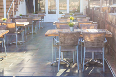 Empty chairs and tables in cafe