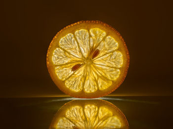 Close-up of lemon slice against black background