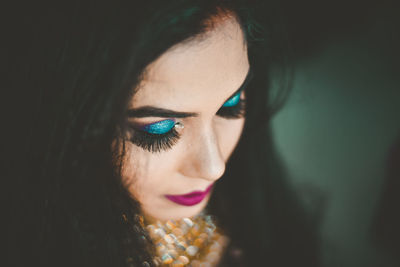 Close-up of beautiful young woman wearing make-up