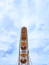 Low angle view of ferris wheel against sky