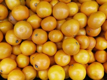 Full frame shot of oranges at market stall