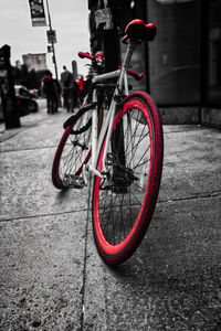 Bicycle parked on sidewalk