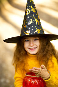 Portrait of smiling girl wearing with hat