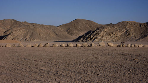 Scenic view of desert against clear sky
