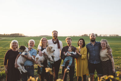 Smiling family looking at camera