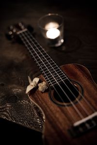 Close-up of illuminated lamp on table