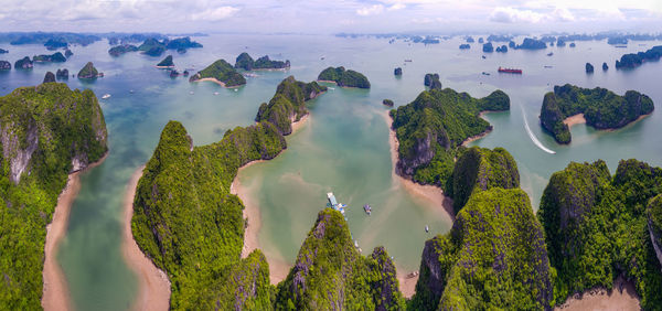 Panoramic view of sea and trees against sky