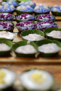 Close-up of purple chili peppers on table