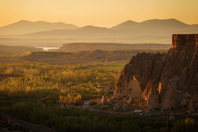 Scenic view of landscape against sky during sunset