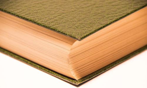 Close-up of books on wood