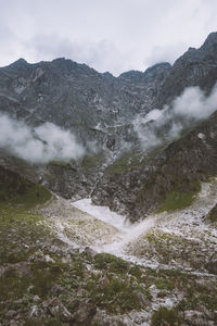 Scenic view of waterfall against sky