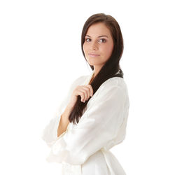 Portrait of a smiling young woman over white background