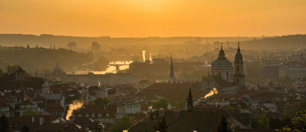 High angle view of city buildings during sunset