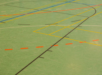 High angle view of dividing lines on floor at court