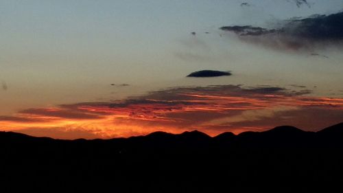 Scenic view of mountains at sunset