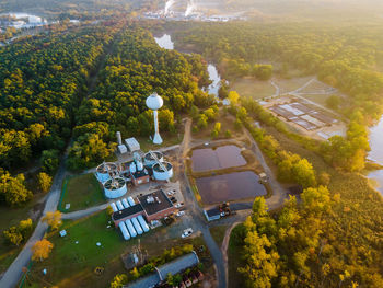 High angle view of trees and buildings in city