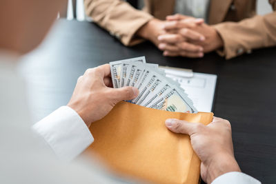 Midsection of business colleagues working in office