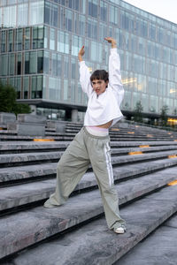 Full length of man standing on steps