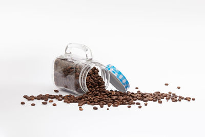 Close-up of coffee beans against white background