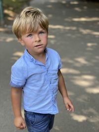 Portrait of cute boy walking outdoors