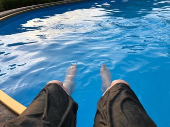 Low section of person in swimming pool