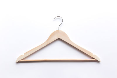 Close-up of empty hanging over white background