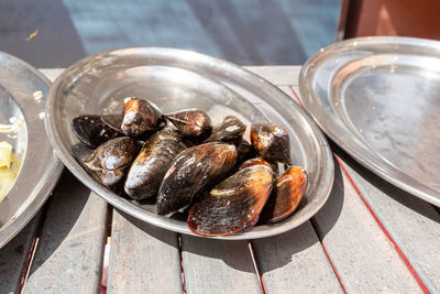 High angle view of oysters in plate on table