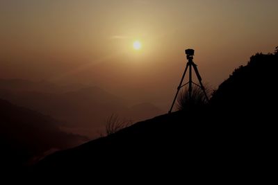 Scenic view of silhouette mountains against sky during sunset