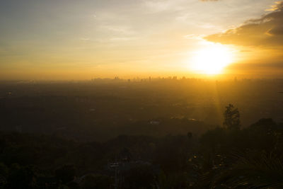 Scenic view of silhouette landscape against sky during sunset