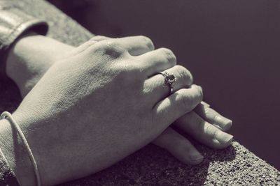 Close-up of couple holding hands