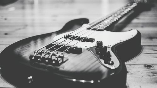 Close-up of guitar on hardwood floor