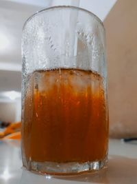 Close-up of beer glass on table