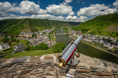 High angle view of cityscape with river against sky